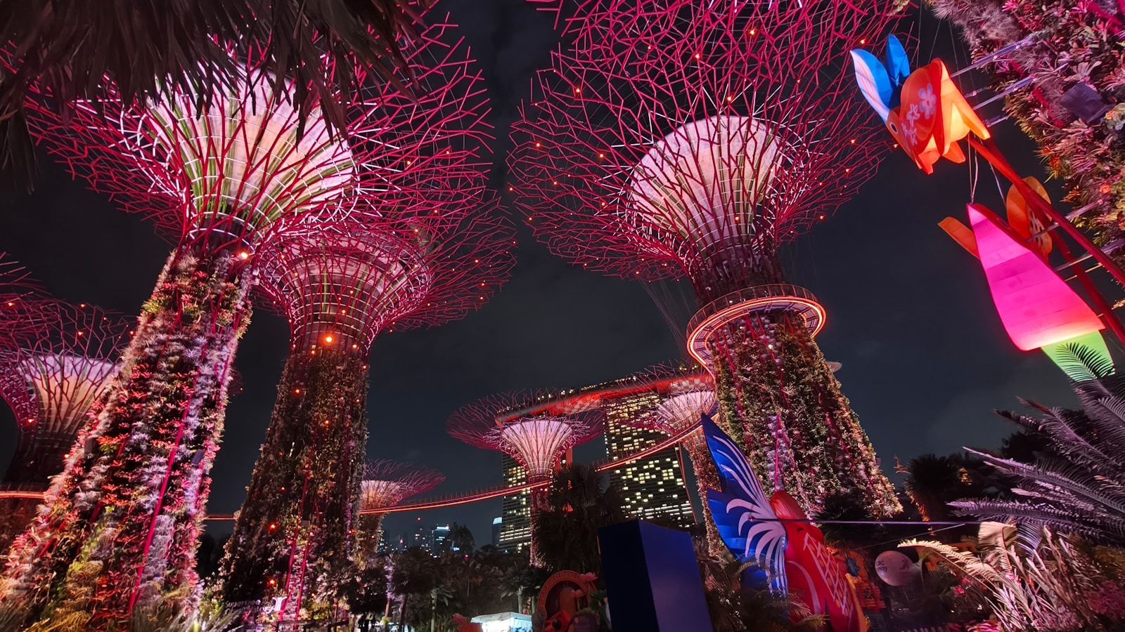 Futuristic glowing trees at night with colorful lanterns